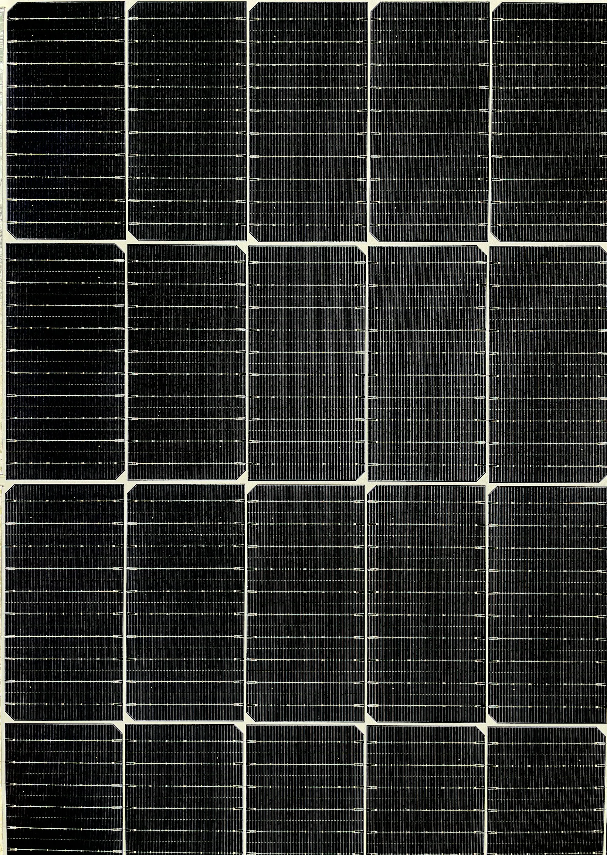 Dark close-up of a solar panel's cell grid